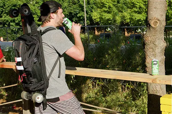 a Longboard Backpack on the back of a man