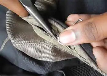 Re-aligning zipper with needle nose plier