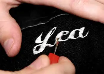 how to remove embroidery from a backpack